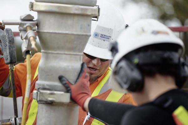 OE crew reviewing a hydrovac utility exposure on site