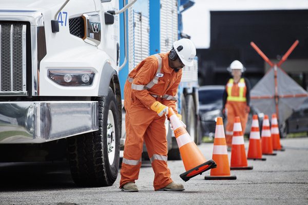 OE hydrovac crew working beside traffic cones for a watermain renewal project